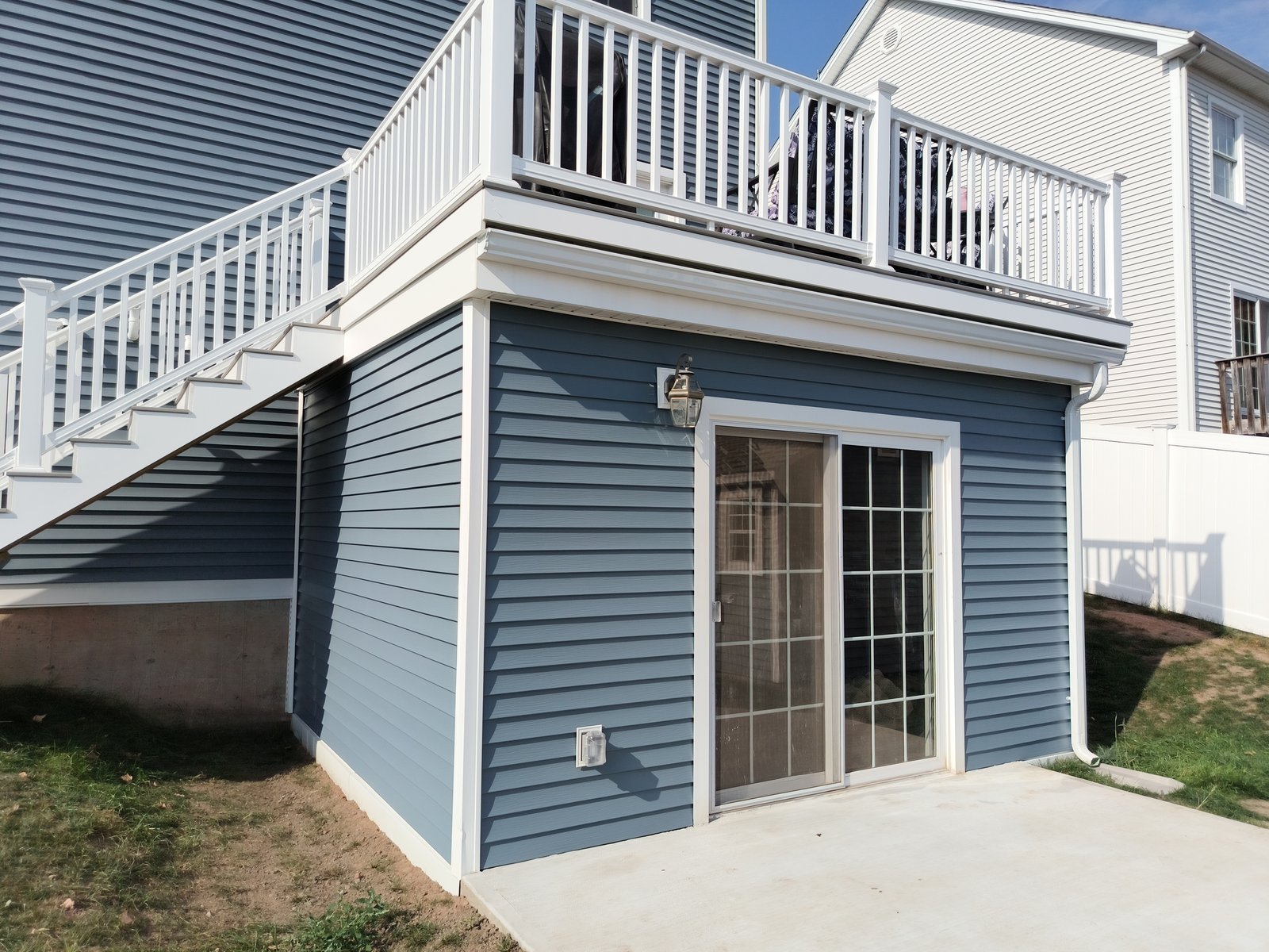 Exterior house — blue siding with white trim