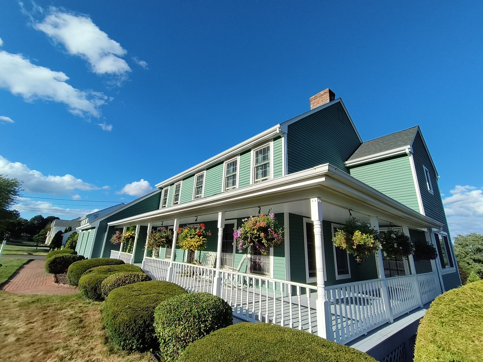 Exterior House Green Siding White Porch — Frank Leonard Painting LLC