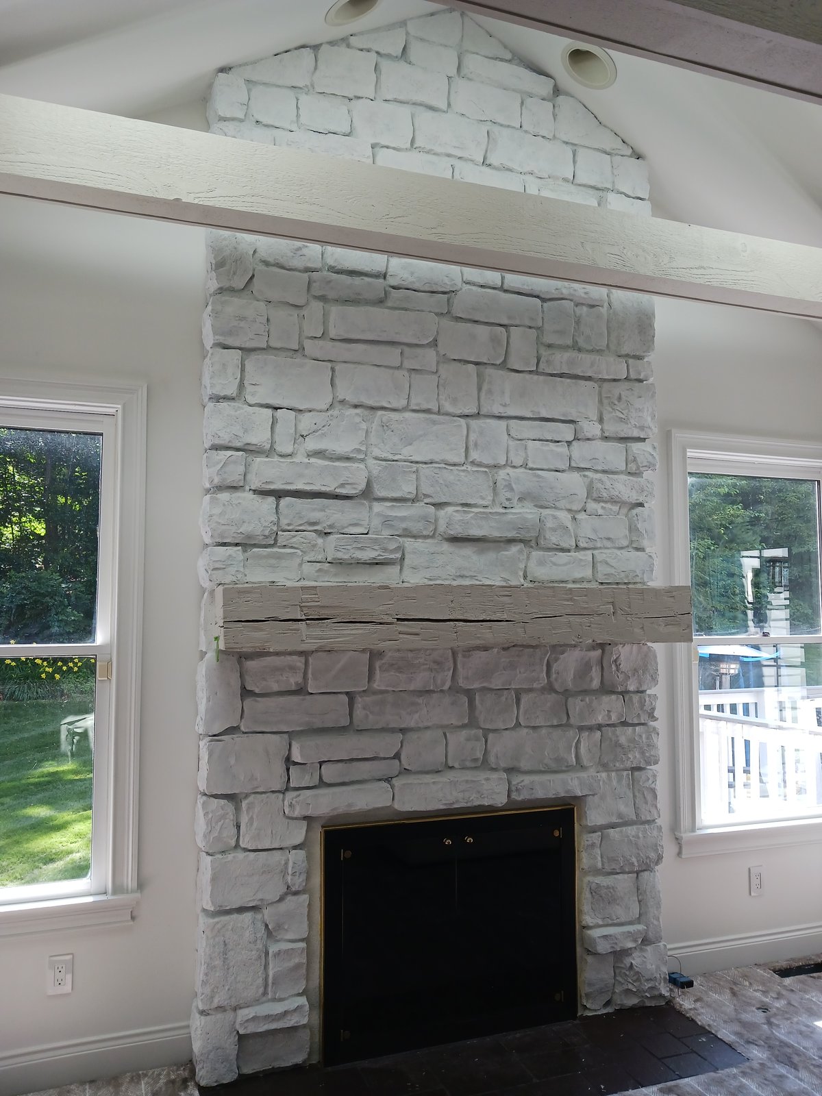 Whitewashed Stone Fireplace Interior — Frank Leonard Painting LLC